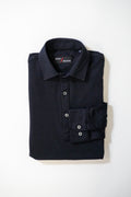 A neatly folded long-sleeve black collared shirt with buttons, displayed on a plain white background. The label inside the collar reads Maro Nelson.